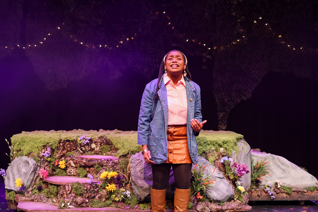 students perform in a musical on stage
