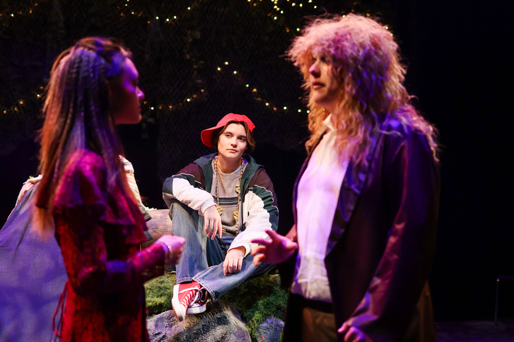 students perform in a musical on stage