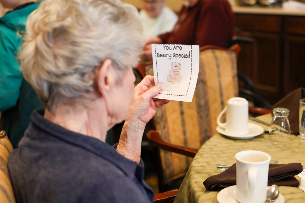 a woman holding a card