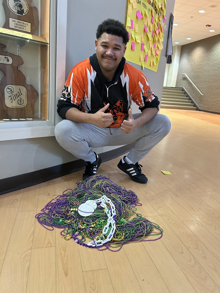 student with beads from Rock Paper Scissors