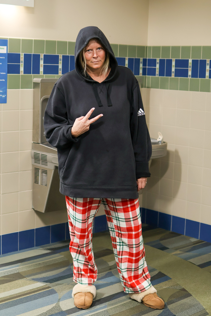 a teacher wearing pajama pants and slippers
