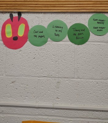 A hungry caterpiller hanging on the wall.