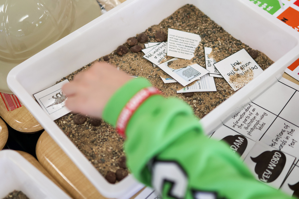 a bucket of sand with words in it
