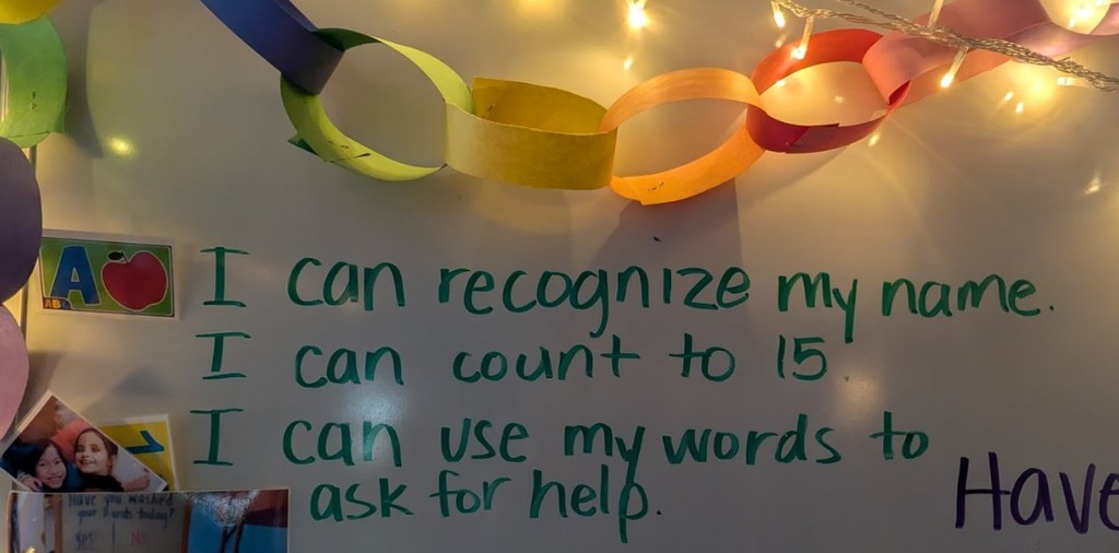 A message on the whiteboard with I can statements to show the classroom goals.