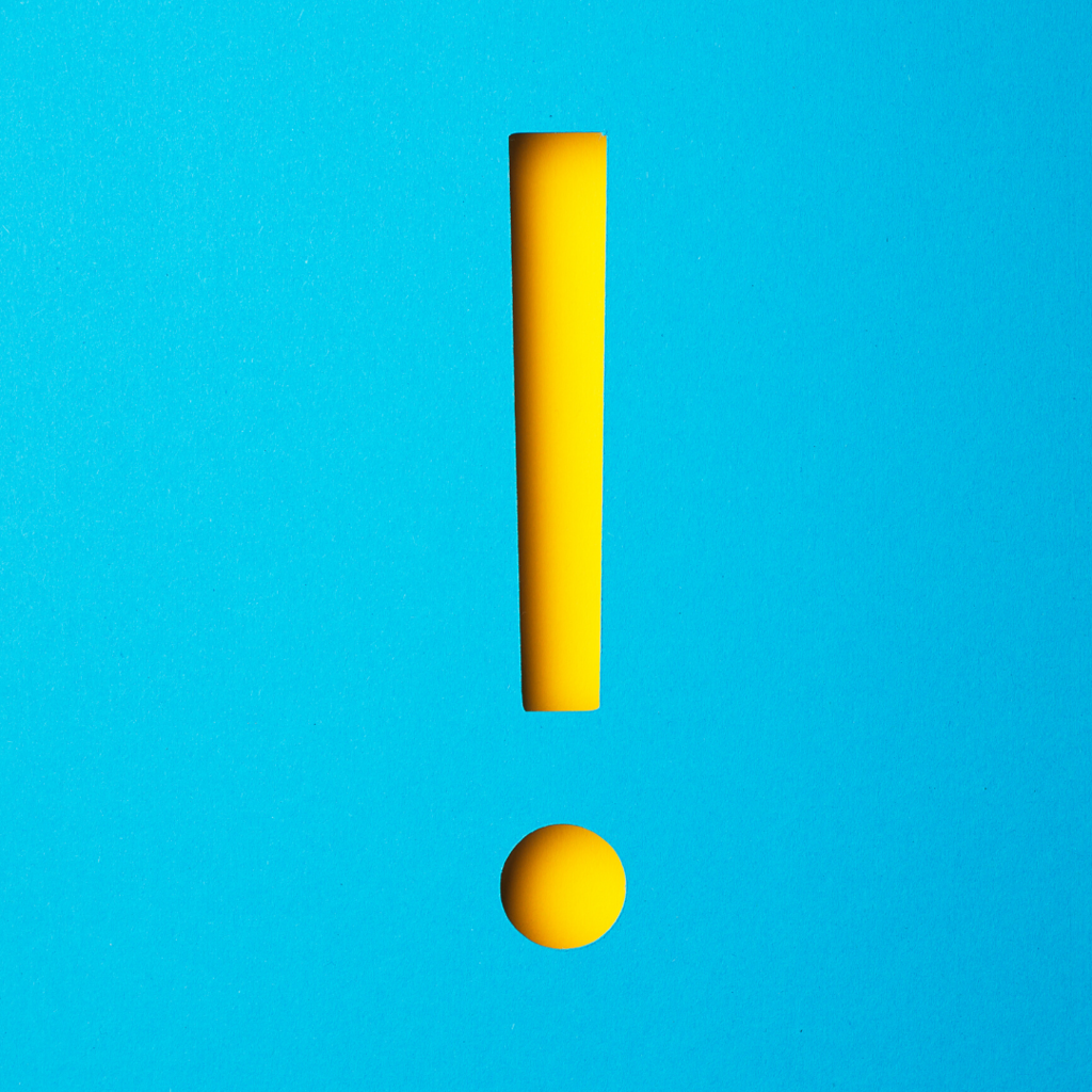 yellow exclamation point on blue background