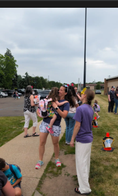 A group of people standing together outside.