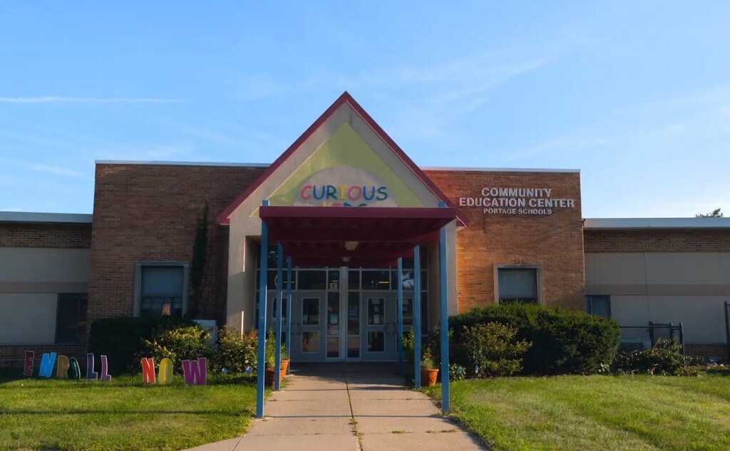 Front of a school building with the sunshining. 