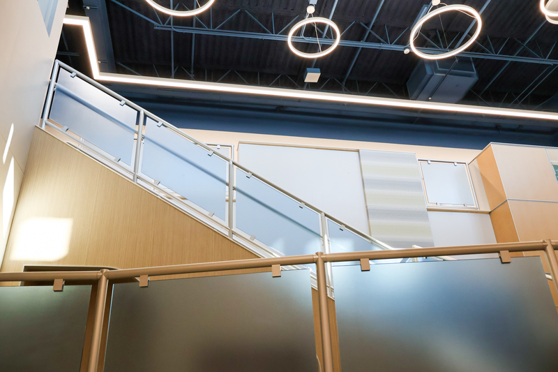 a stairwell with overhanging circle lights