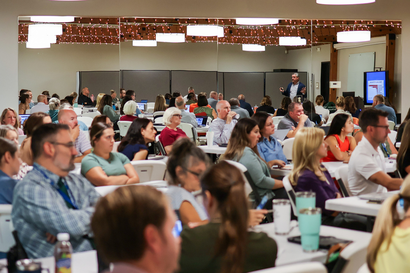 a room full of people sitting down