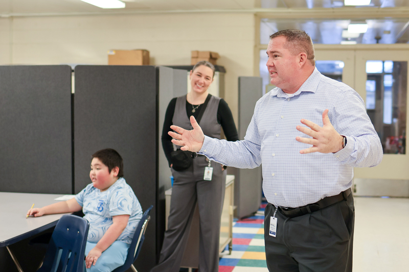 a man speaking in a classroom