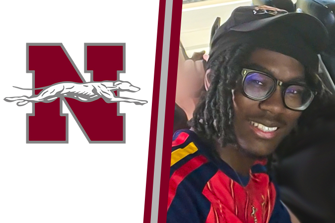 Elijah Stith next to Norcom High School Logo