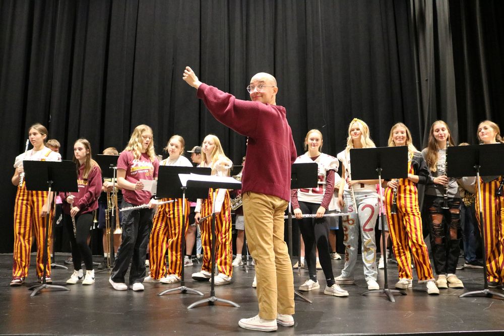 Mr. Morley directs band during homecoming pep rally