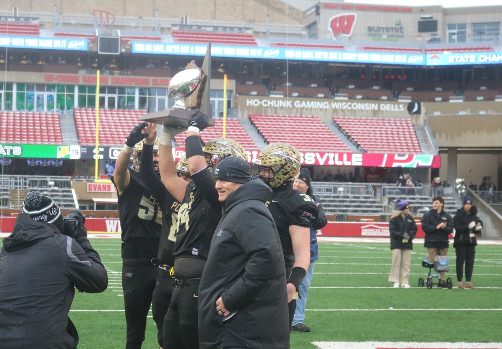 Coach Siegert with players at state championship 2024