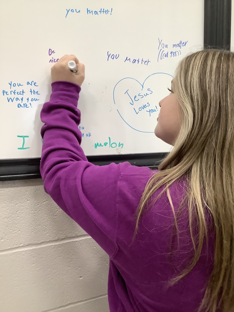 Image of student writing on Hope Wall