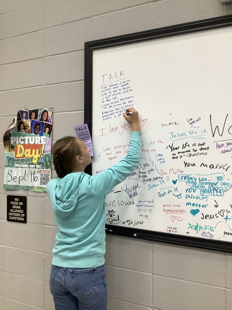Image of student writing on Hope Wall