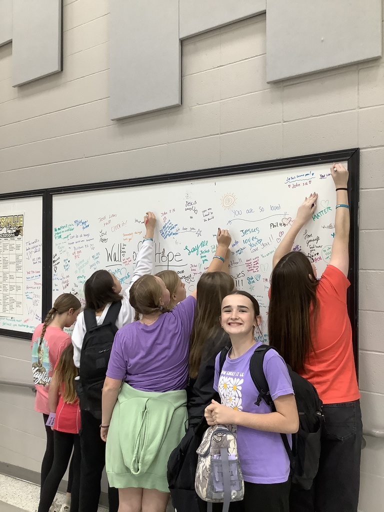 Image of student writing on Hope Wall