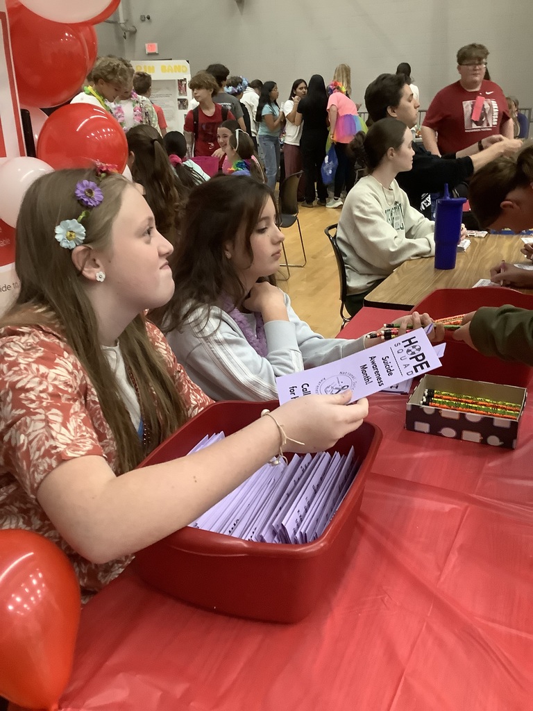 Image of members working booth