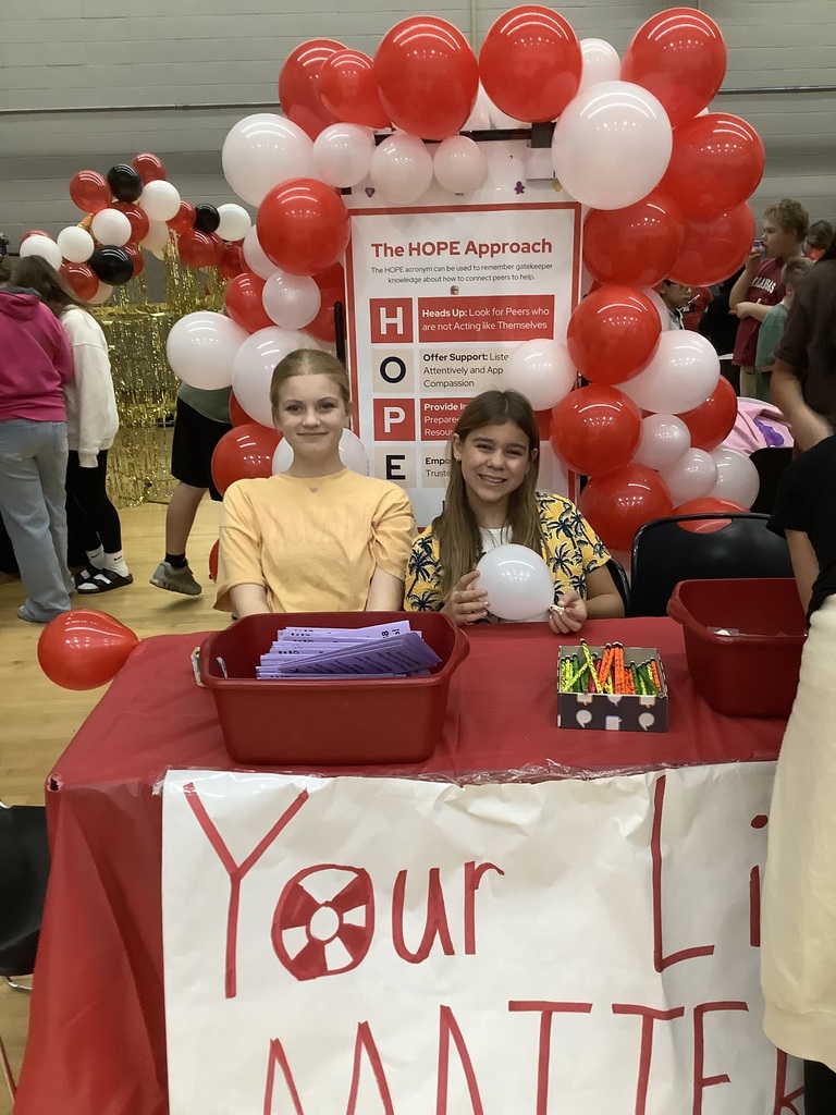 Image of members working booth
