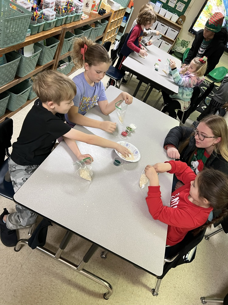 PES students and Tech student making reindeer food