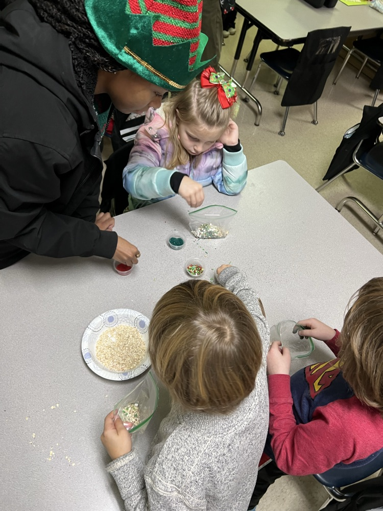 PES students and Tech student making reindeer food