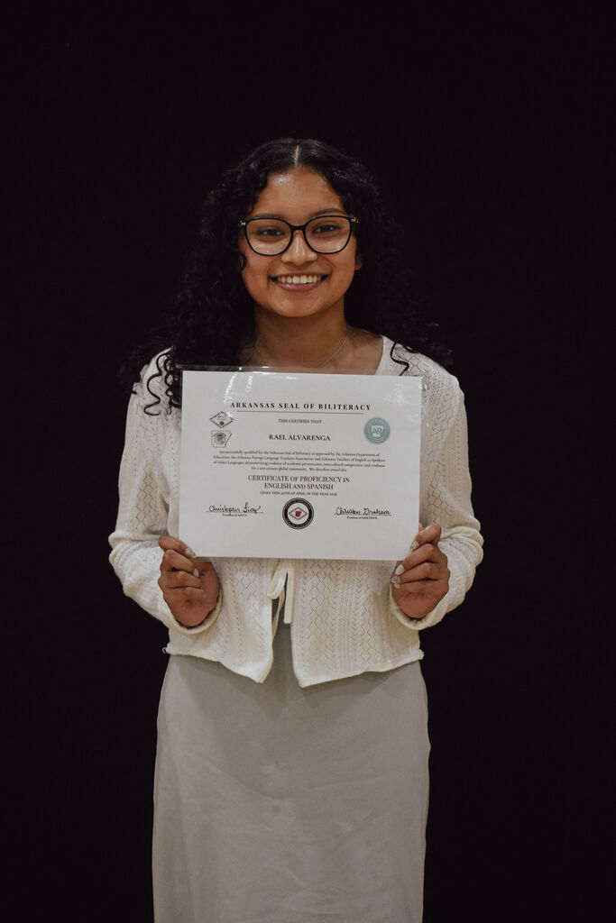 Senior Rael Alvarenga receives the Arkansas State Seal of Biliteracy Certificate at PHS Senior Awards. 