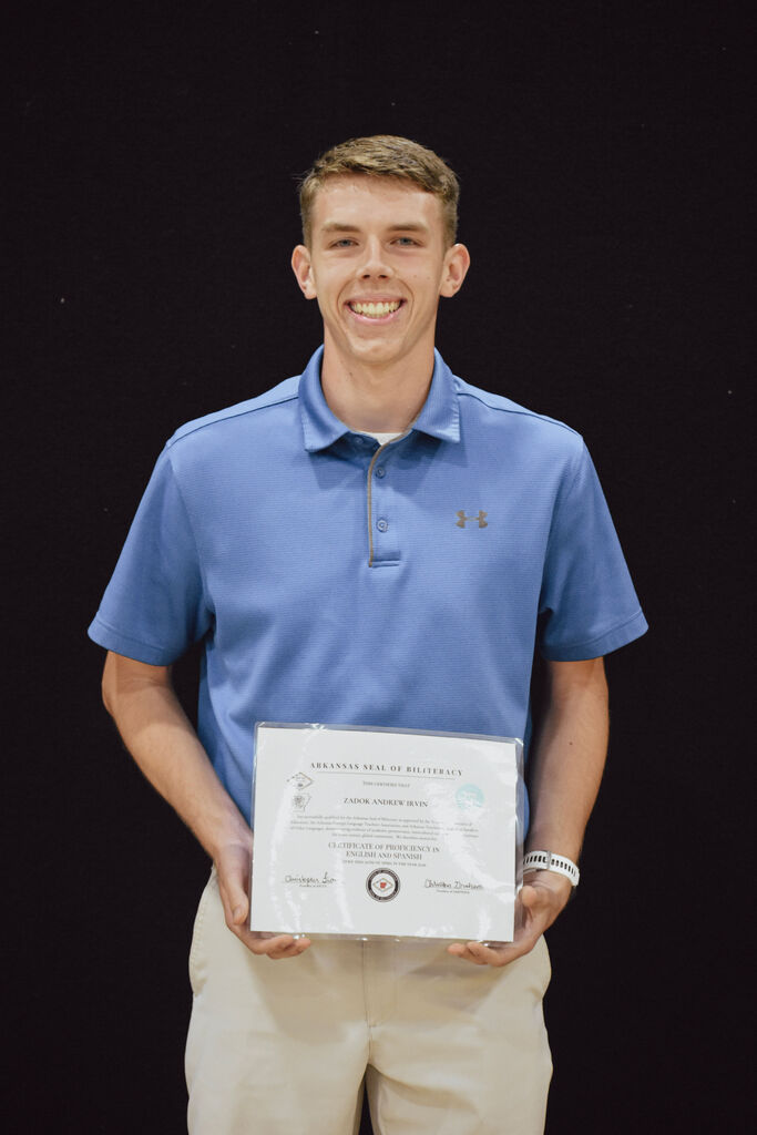 Senior Zadok Irvin receives the Arkansas State Seal of Biliteracy Certificate at PHS Senior Awards. 