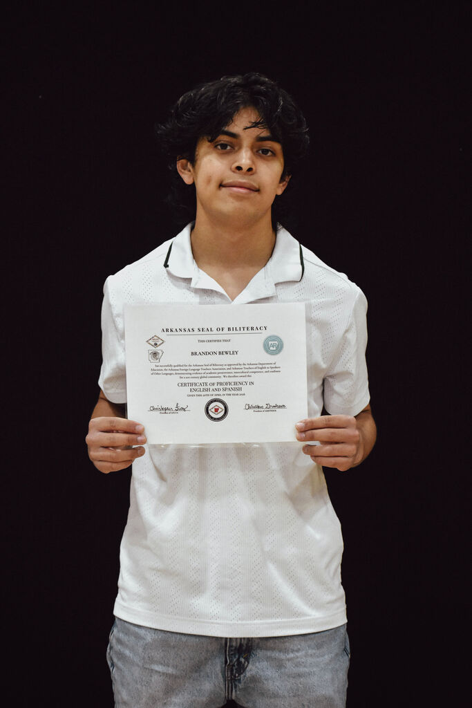 Senior Brandon Bewley receives the Arkansas State Seal of Biliteracy Certificate at PHS Senior Awards. 