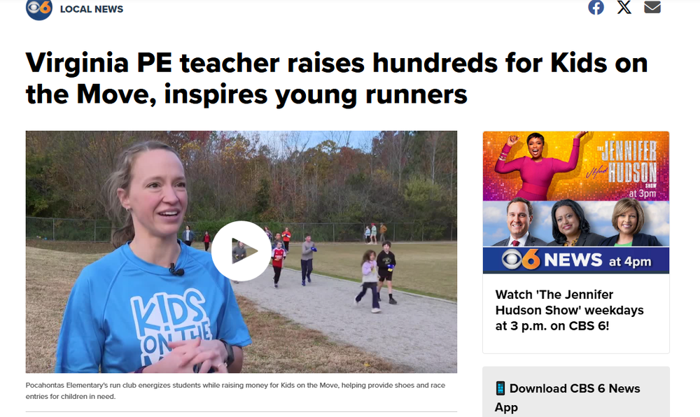 A smiling woman wearing a blue “Kids on the Move” shirt stands outdoors while speaking to the camera. Behind her, several elementary-aged children run on a gravel track with trees and fall foliage in the background. A play button icon appears over the video thumbnail.