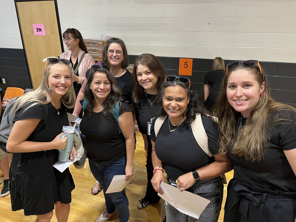 A group of people pose for a photo.