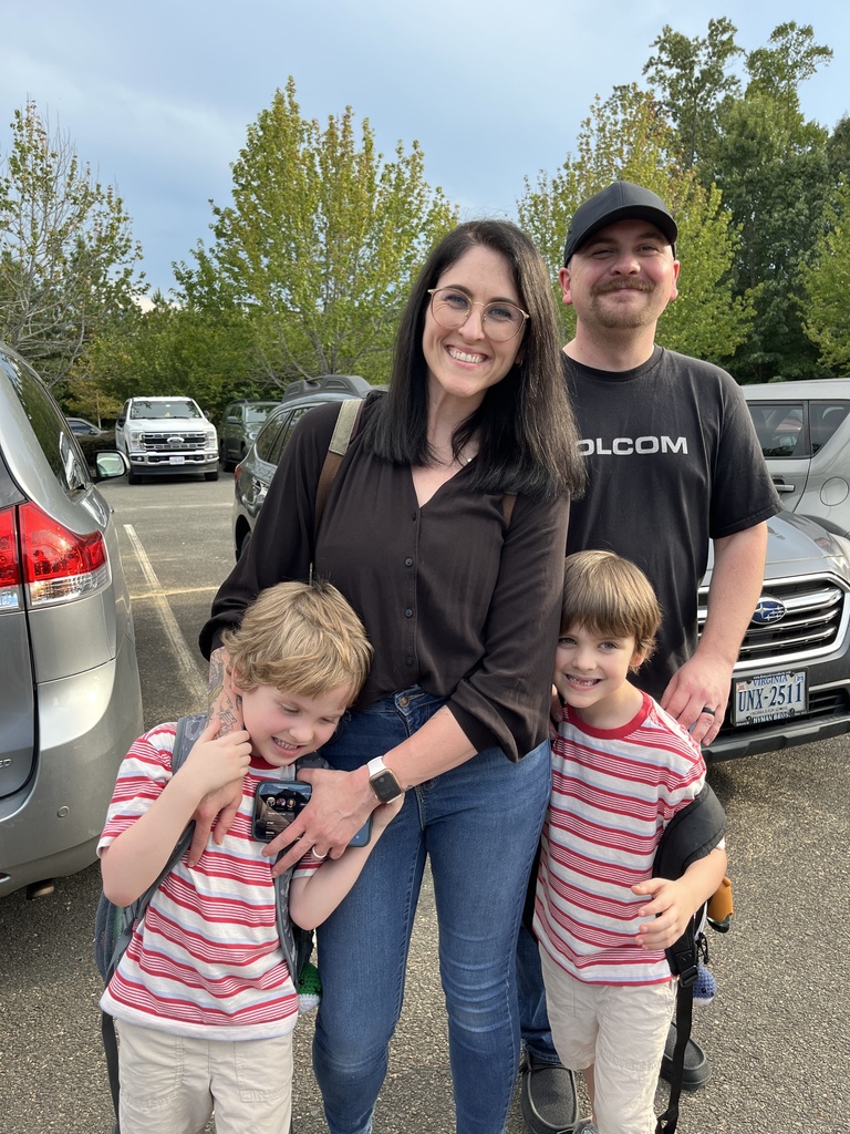 Two adults and two children pose for a photo. 