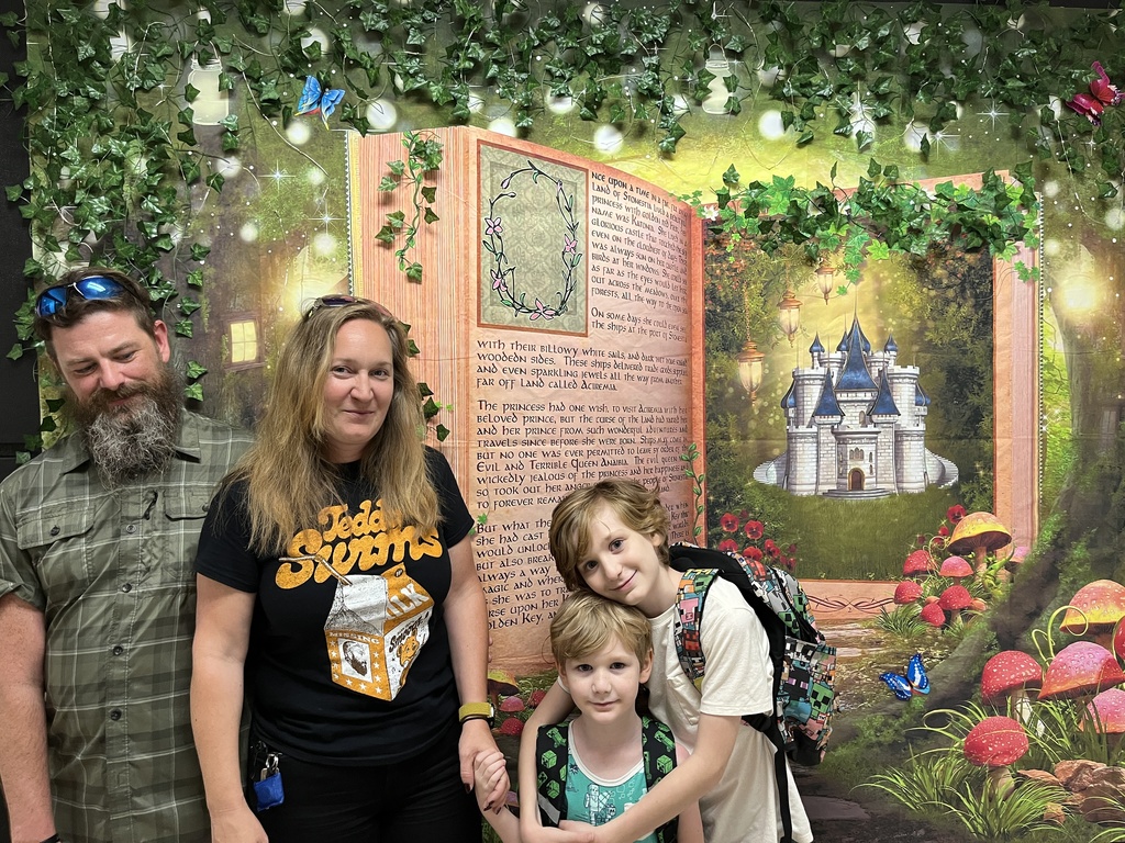 Two adults and two children  pose for a photo. 