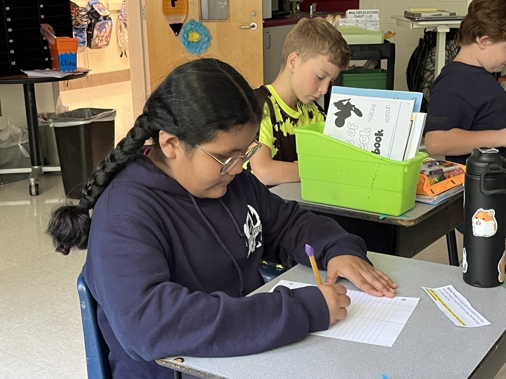 Students work on their first writing prompt exercise of the school year. 