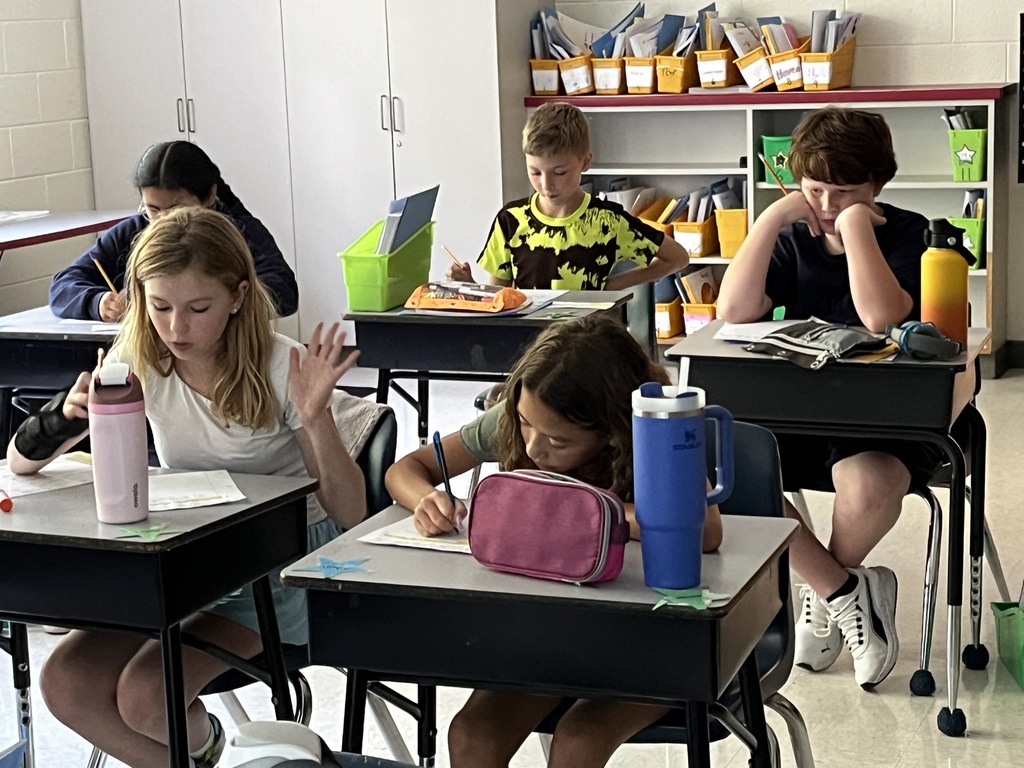 Students work on their first writing prompt exercise of the school year. 