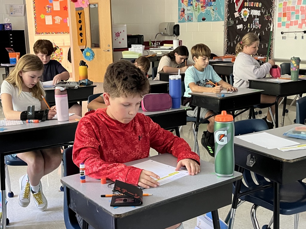 Students work on their first writing prompt exercise of the school year. 