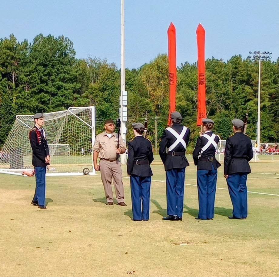 JROTC cadets  present  the Colors at a community event. 