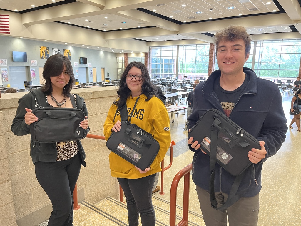 Students pose with their newly assigned Chromebooks.