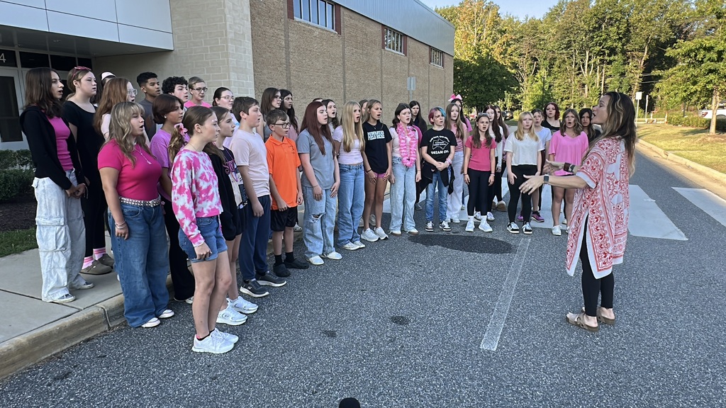 An 8th grade choir sings the national anthem during a 9/11 ceremony.