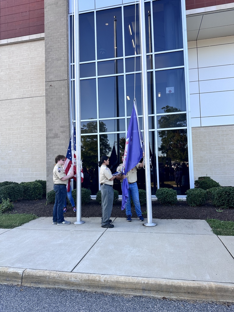 Boy Scout troop members raise the flags during a 9/11 ceremony.