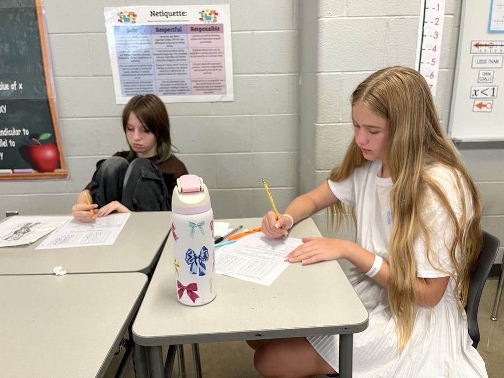 Students participate in a perfect square day activity. 