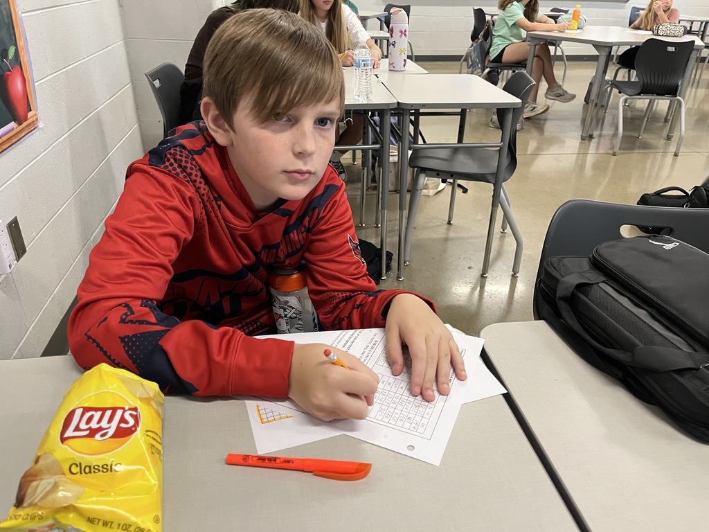 Students participate in a perfect square day activity. 
