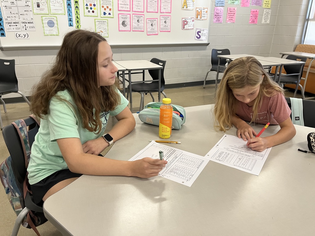 Students participate in a perfect square day activity. 