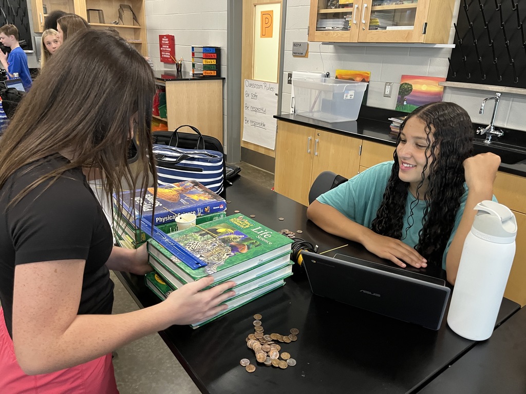 Students build bridges out of spaghetti noodles in science class.