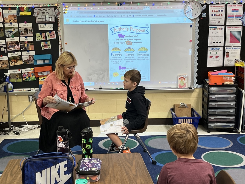 A teacher and student model good reading etiquette.