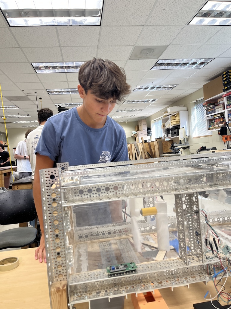 Students build  and test wind turbines in engineering class.