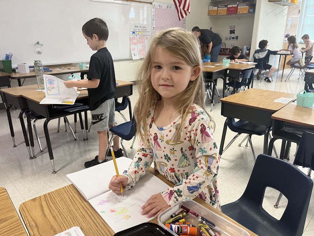 Students participate in math and literacy stations in a class.