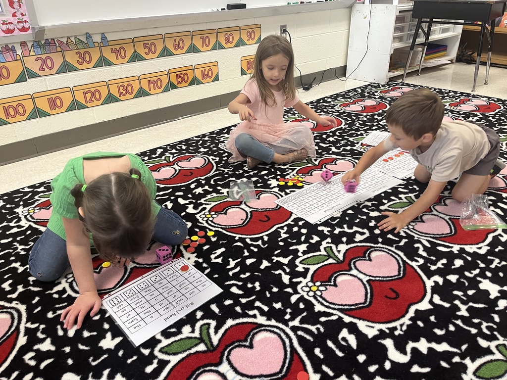 Students participate in a math  station in class.
