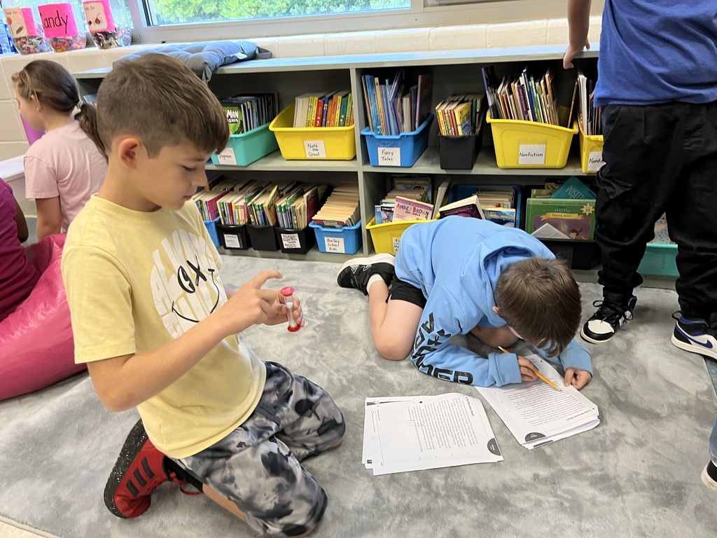 Students work in pairs and take turns reading an article aloud.