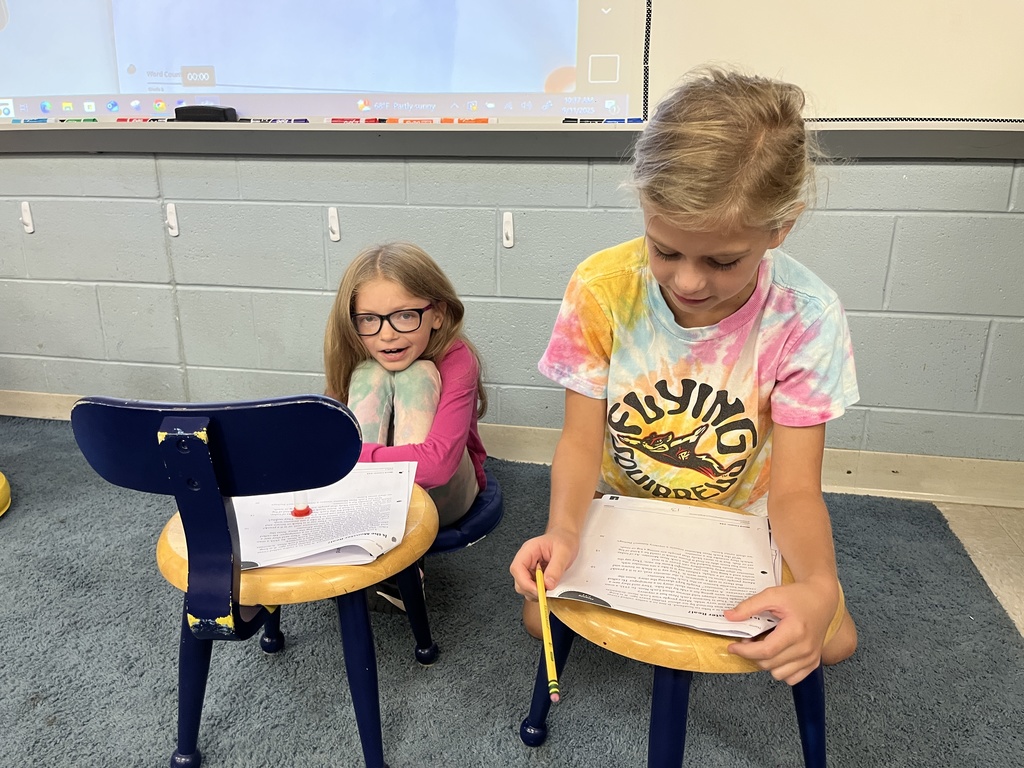 Students work in pairs and take turns reading an article aloud.