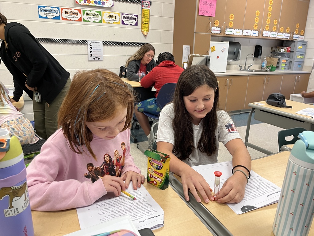 Students work in pairs and take turns reading an article aloud.