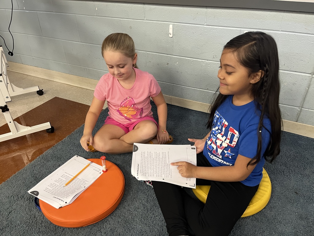 Students work in pairs and take turns reading an article aloud.
